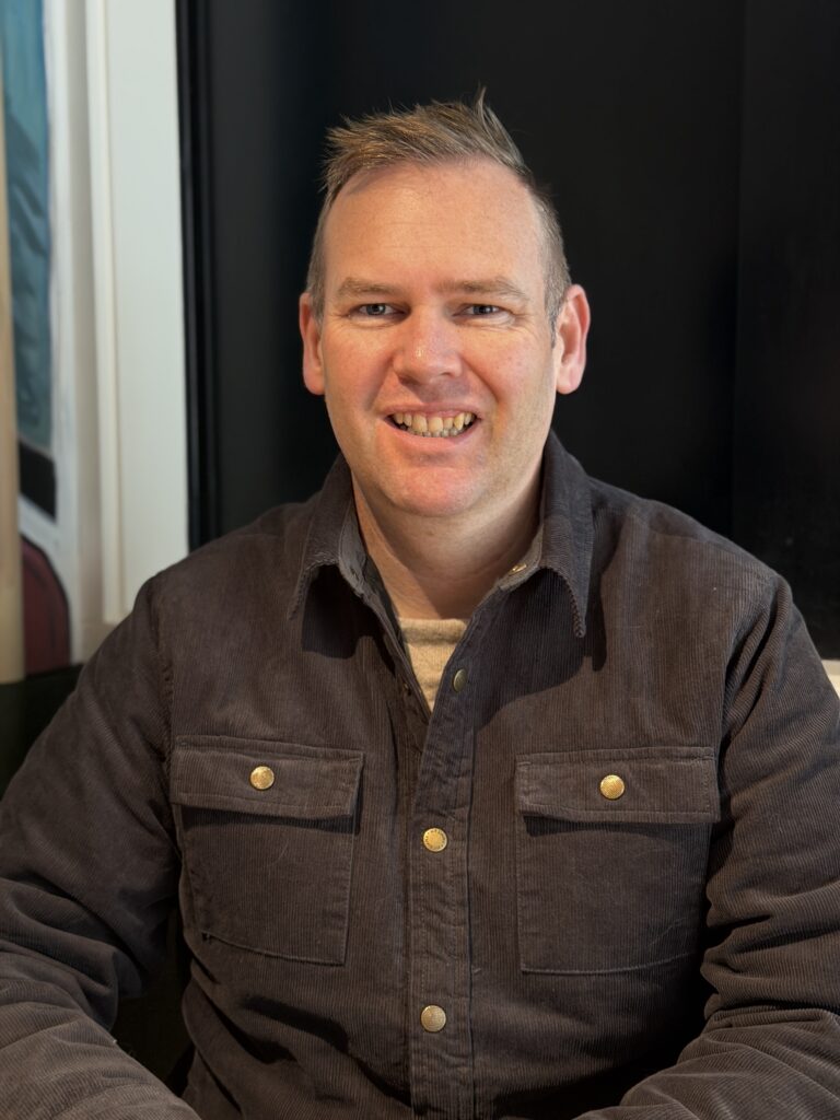 Nick, the founder of Senior Gadget Guide, smiling. 